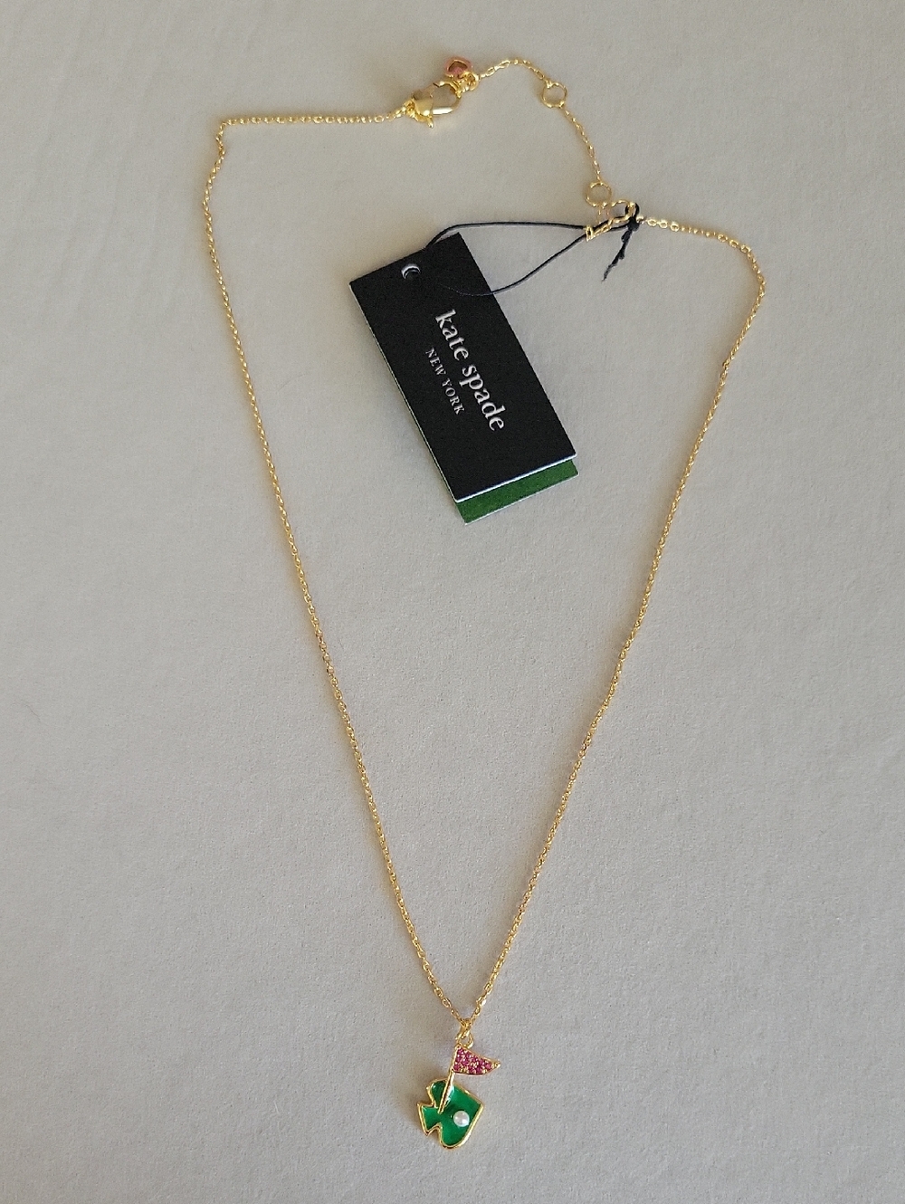 kate spade Gold-Tone Necklace with Green Clover and Pink Flag Charm